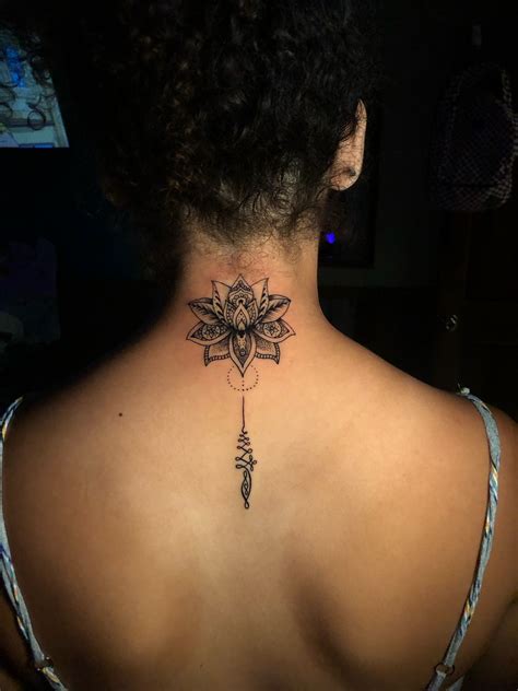 flower neck tattoo|lotus flower female tattoo.